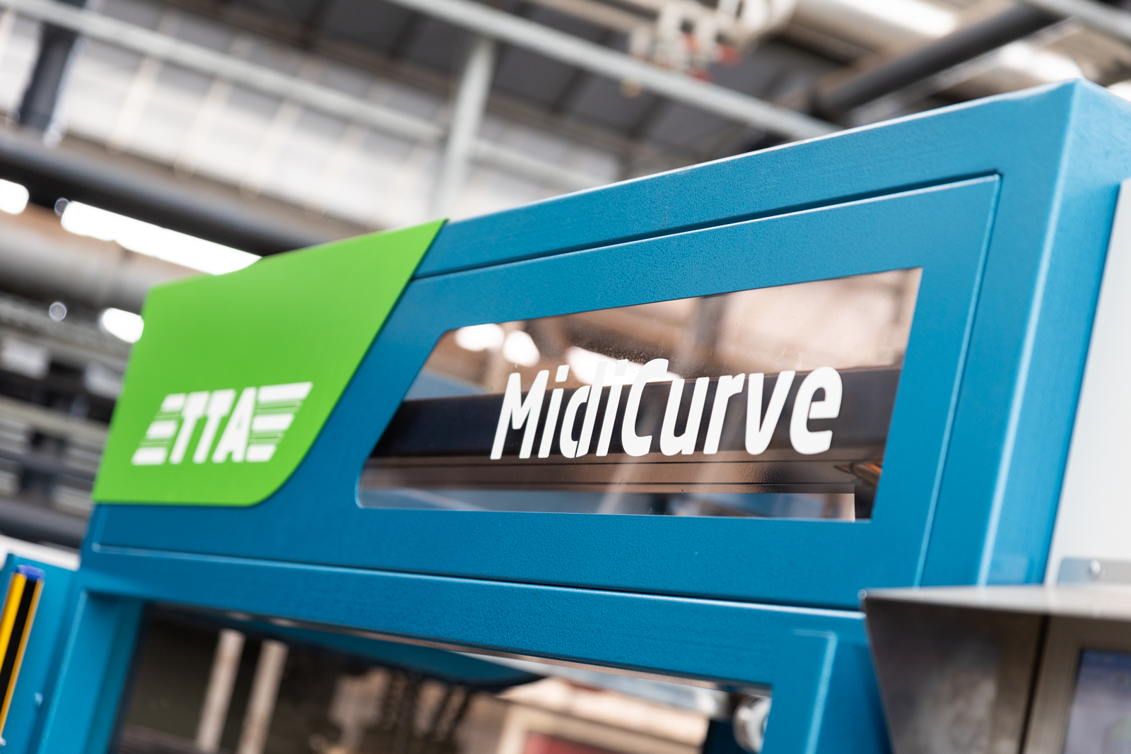 Nom de la machine MidiCurve, la remplisseuse de pots circulaire de TTA-ISO